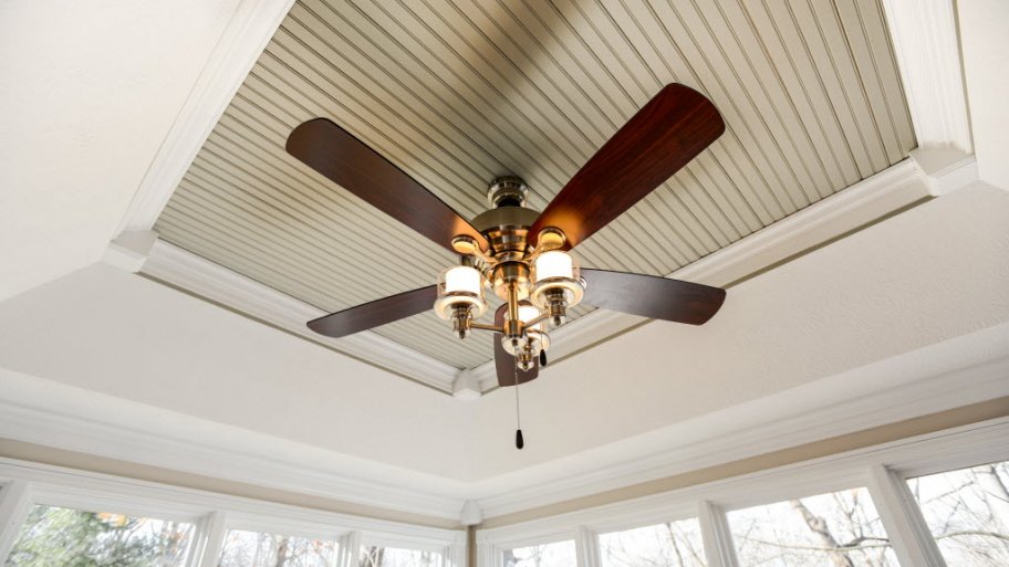 ceiling fan with lights, mounted inside a house